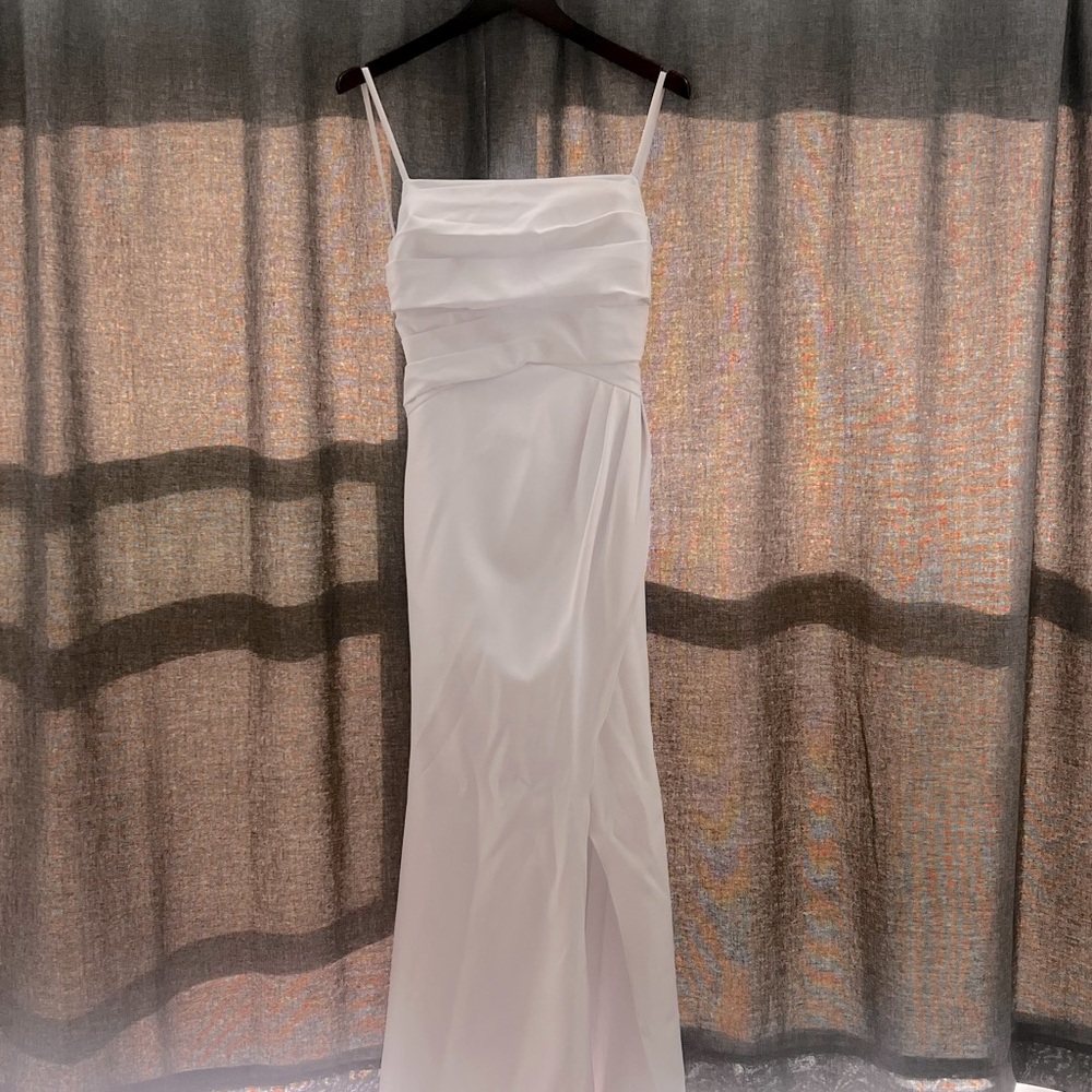 Wedding dress slit on the side never worn bow in back